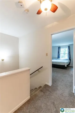 a bedroom with a bed and chair