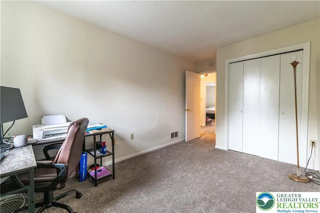 a workspace with furniture and window