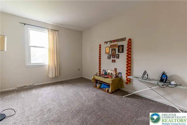 a bathroom with a toilet a sink and a mirror