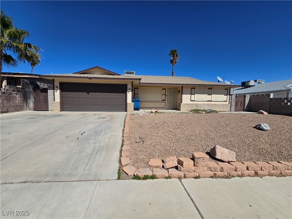 7016 Hurricane Way, Unit A Las Vegas, NV 89145 - Photo 1 of 15 Single story home with an attached garage, brick s