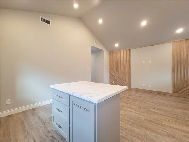 a view of kitchen with sink and microwave