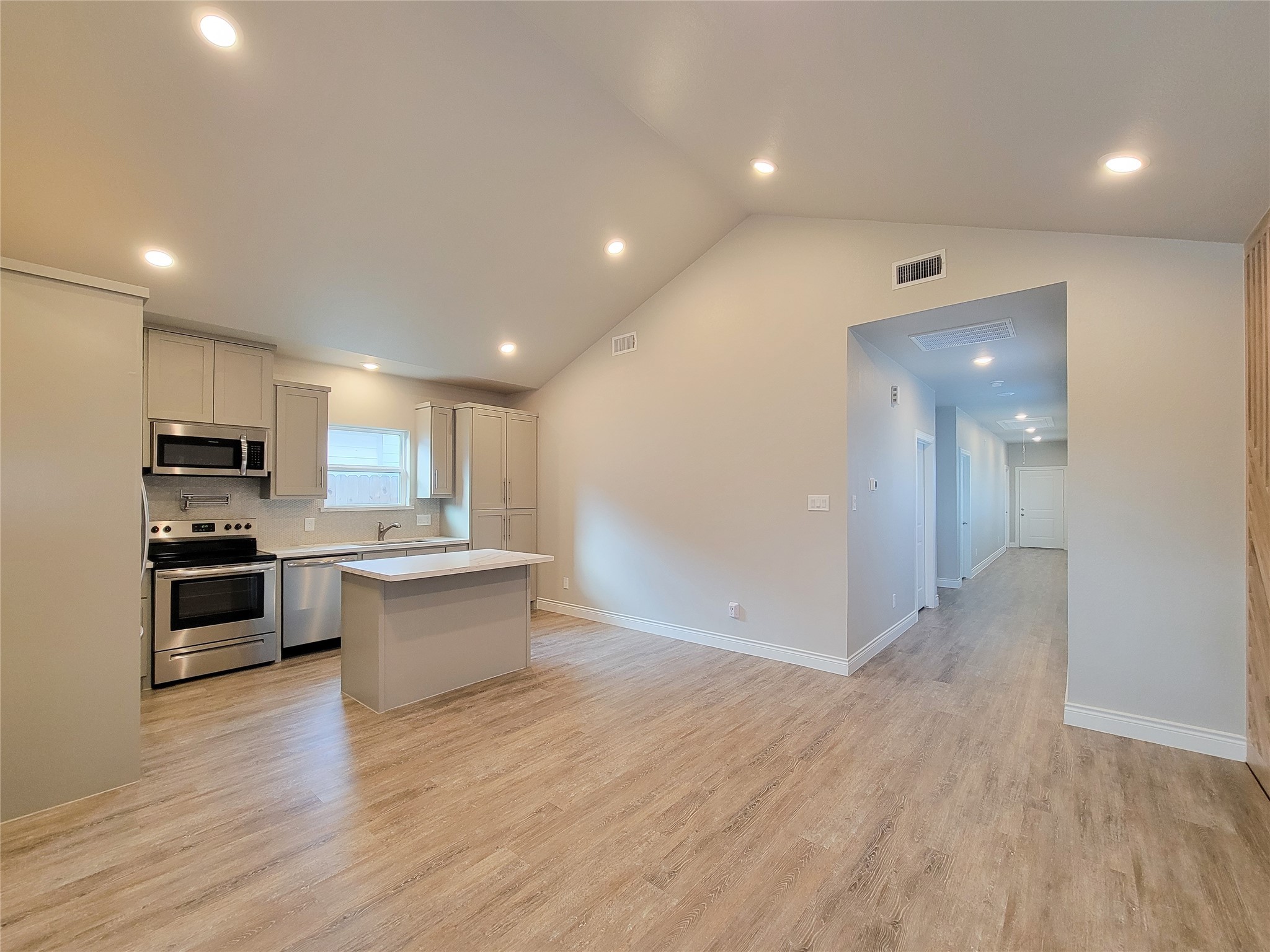 216 West Live Oak Street Angleton, TX 77515 - Photo 13 of 40 a view of kitchen with sink and microwave