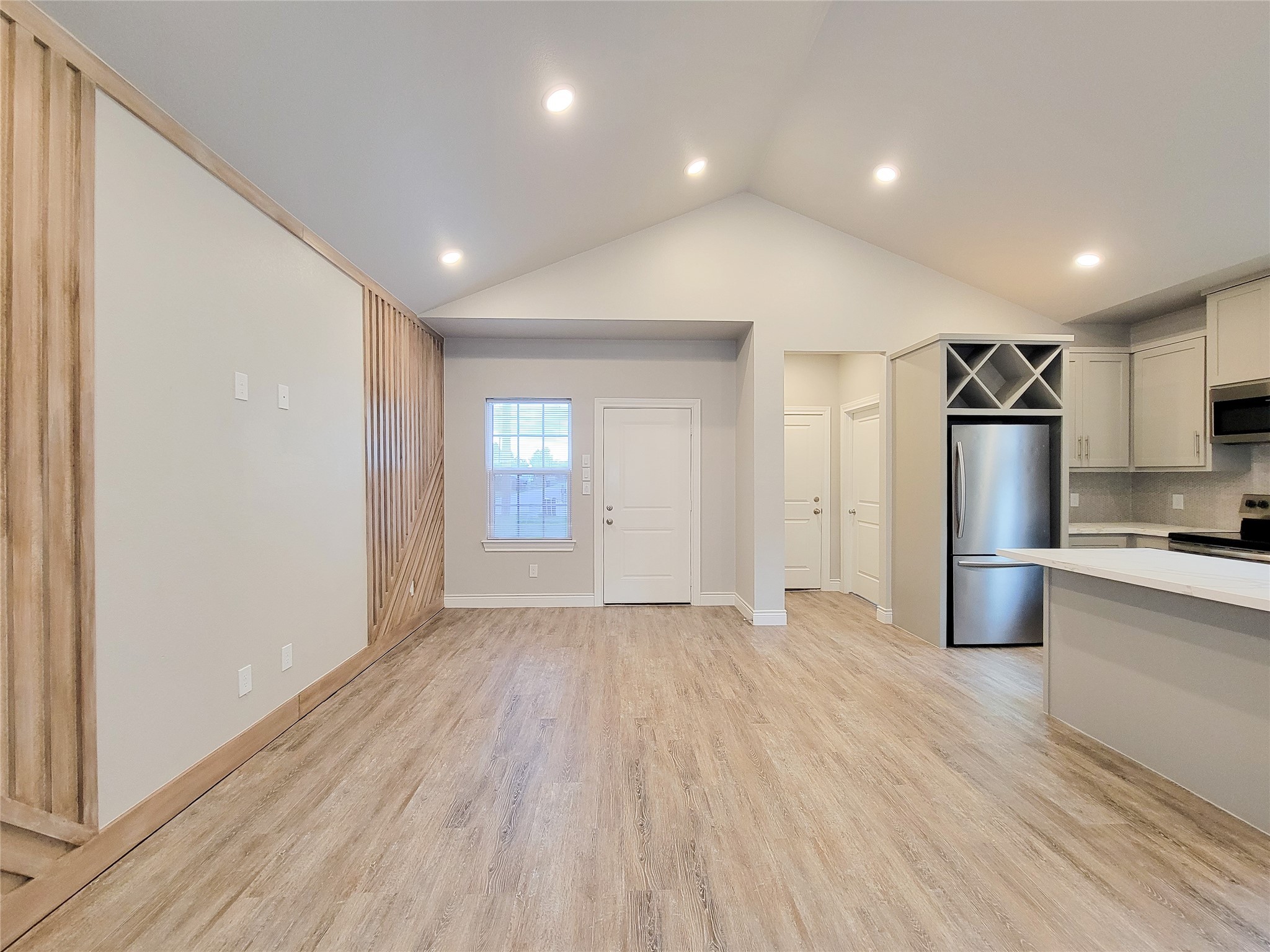 216 West Live Oak Street Angleton, TX 77515 - Photo 14 of 40 a view of a kitchen with a sink and a refrigerator