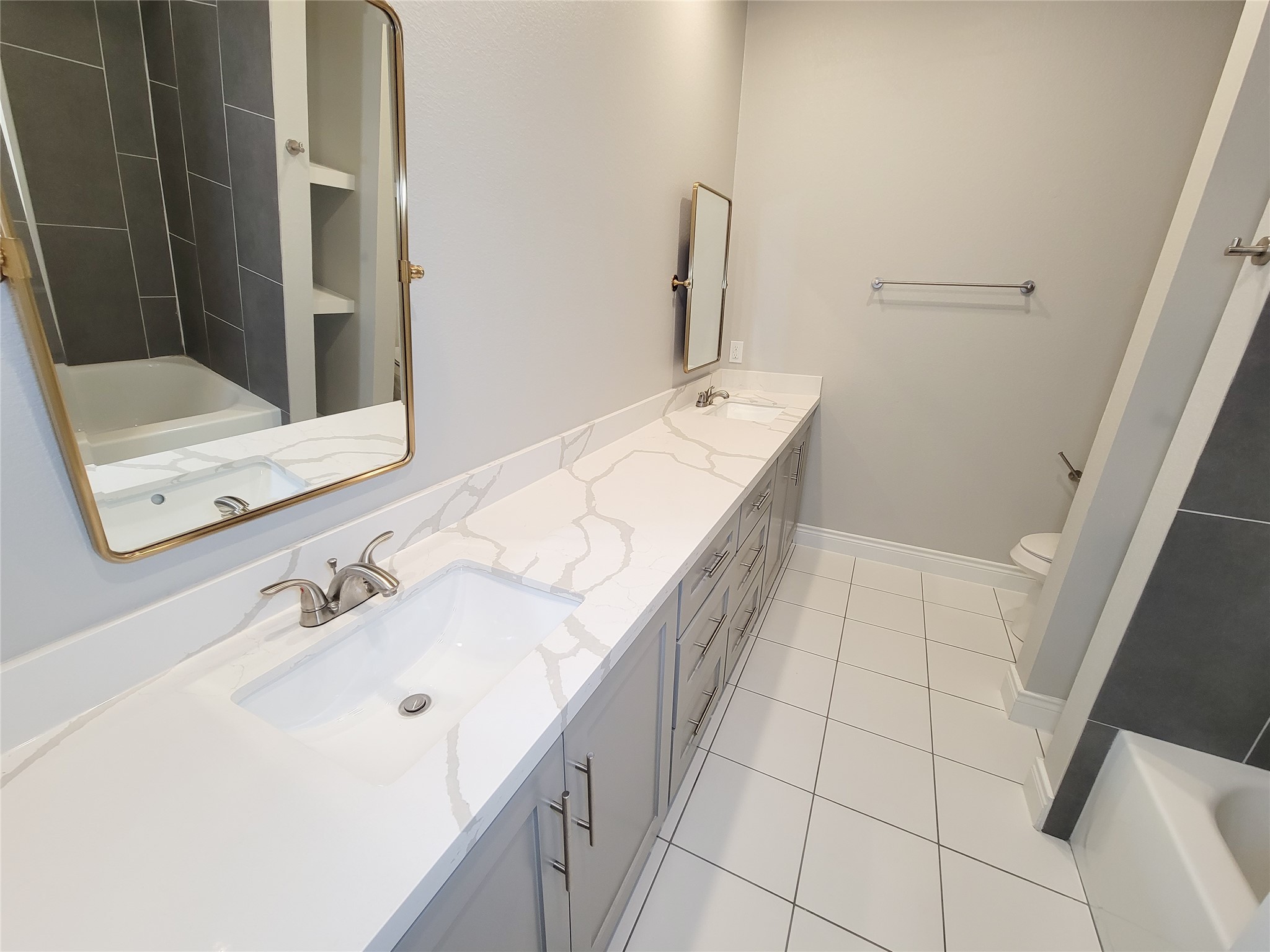 216 West Live Oak Street Angleton, TX 77515 - Photo 20 of 40 a bathroom with a sink and a mirror