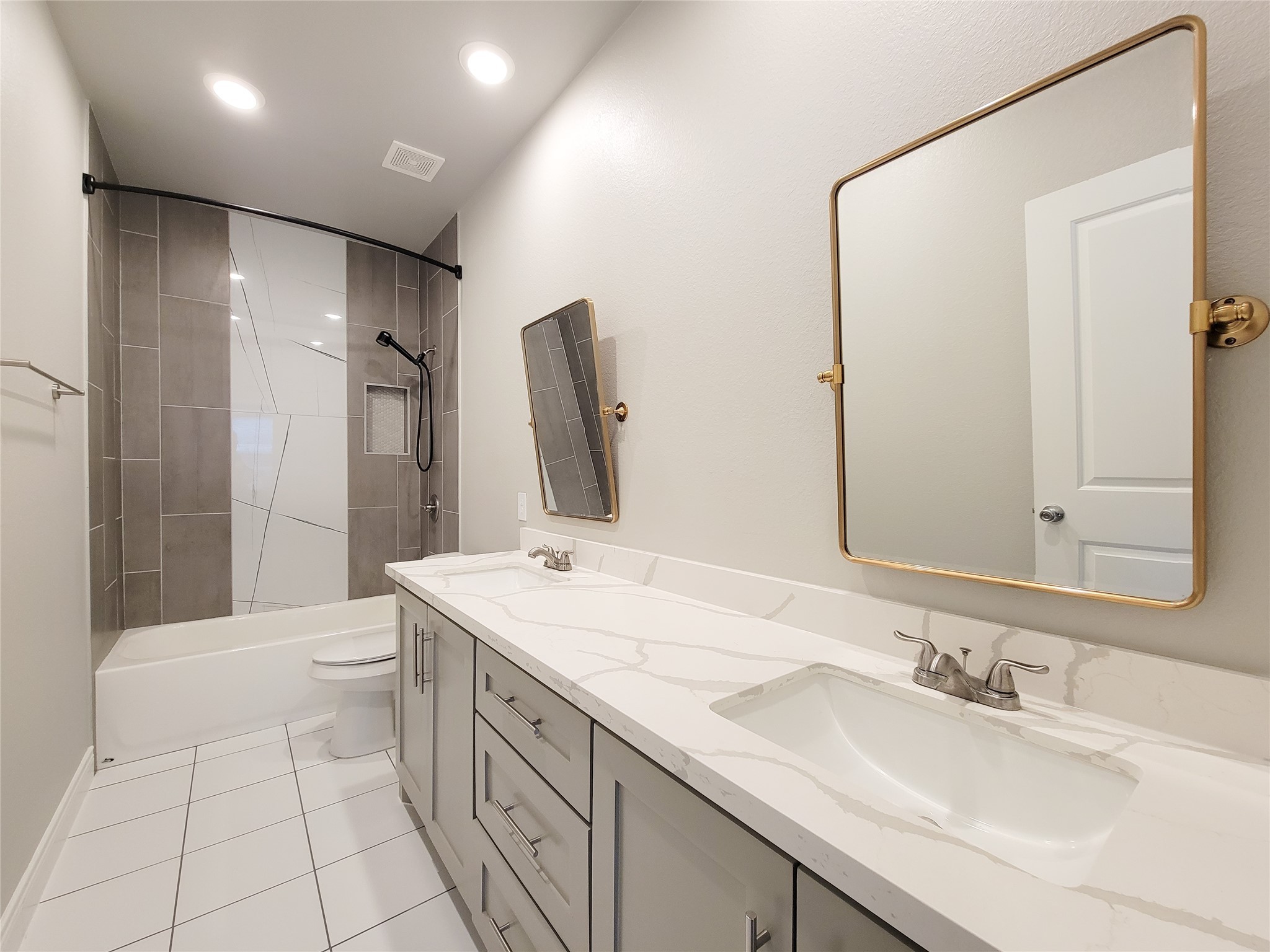 216 West Live Oak Street Angleton, TX 77515 - Photo 27 of 40 a bathroom with a double vanity sink mirror double and shower