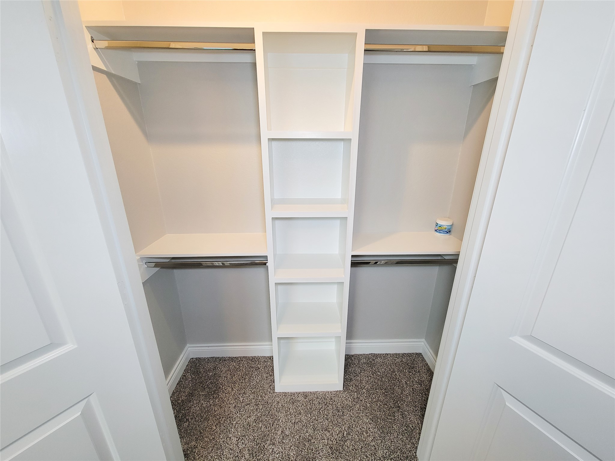 216 West Live Oak Street Angleton, TX 77515 - Photo 31 of 40 a view of walk in closet with empty racks