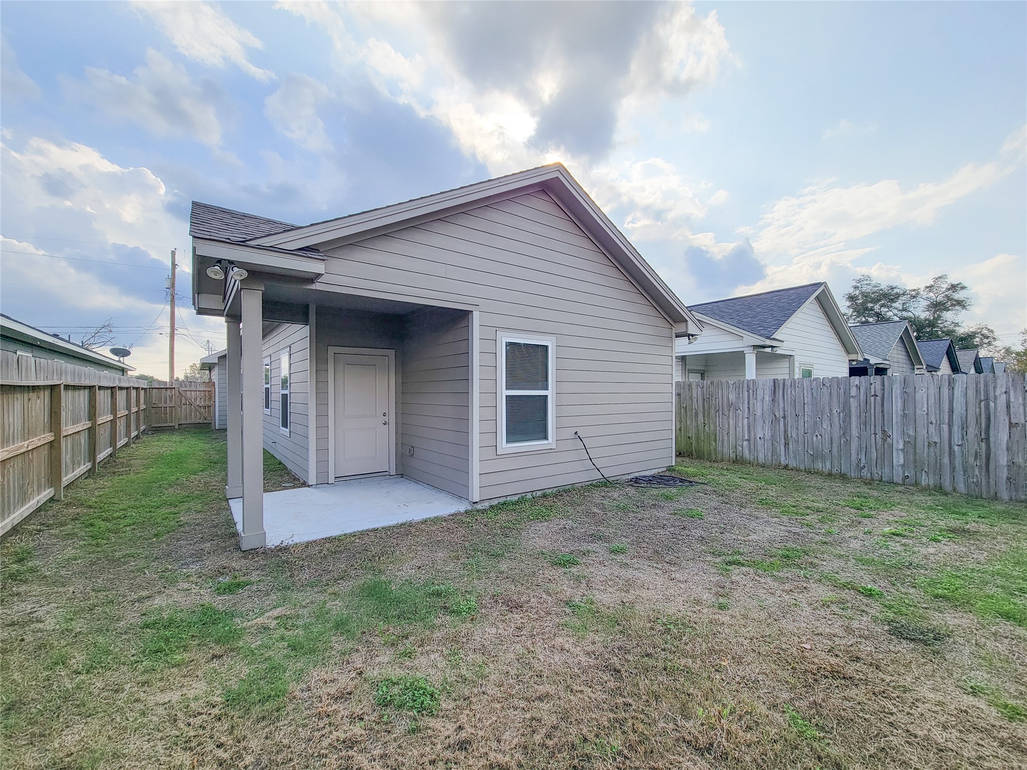 216 West Live Oak Street Angleton, TX 77515 - Photo 34 of 40 a view of a house with wooden fence
