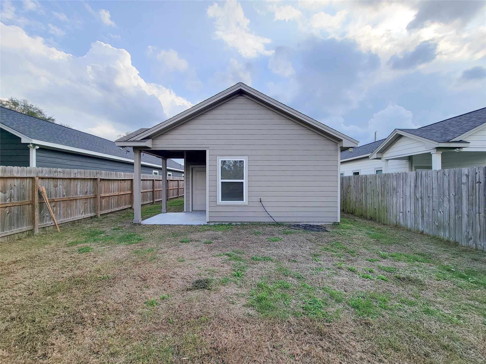 216 West Live Oak Street Angleton, TX 77515 - Photo 35 of 40 a view of a backyard with wooden fence