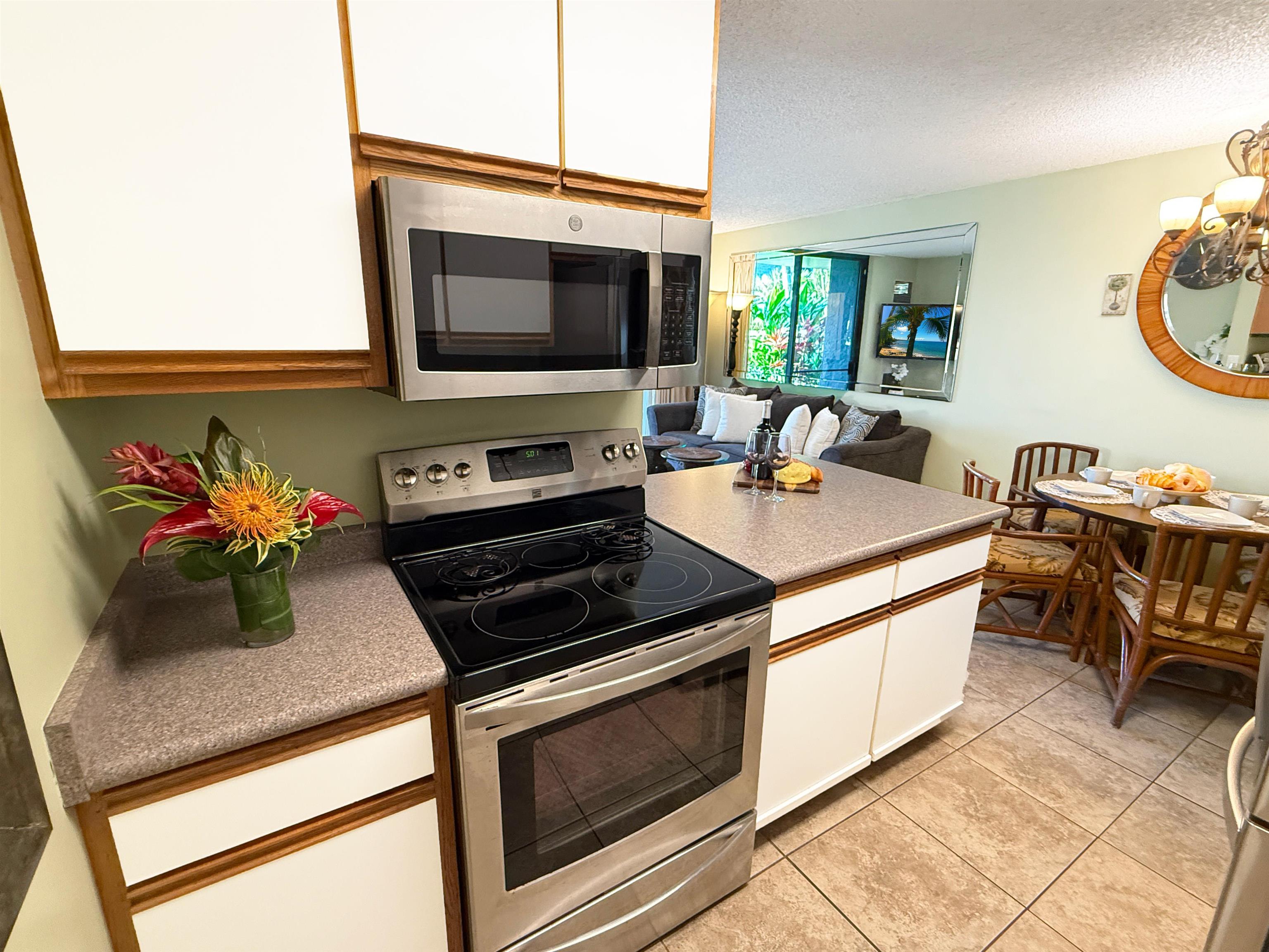 938 South Kihei Road, Unit 109 Kihei, HI 96753 - Photo 14 of 30 a kitchen with a stove and a microwave