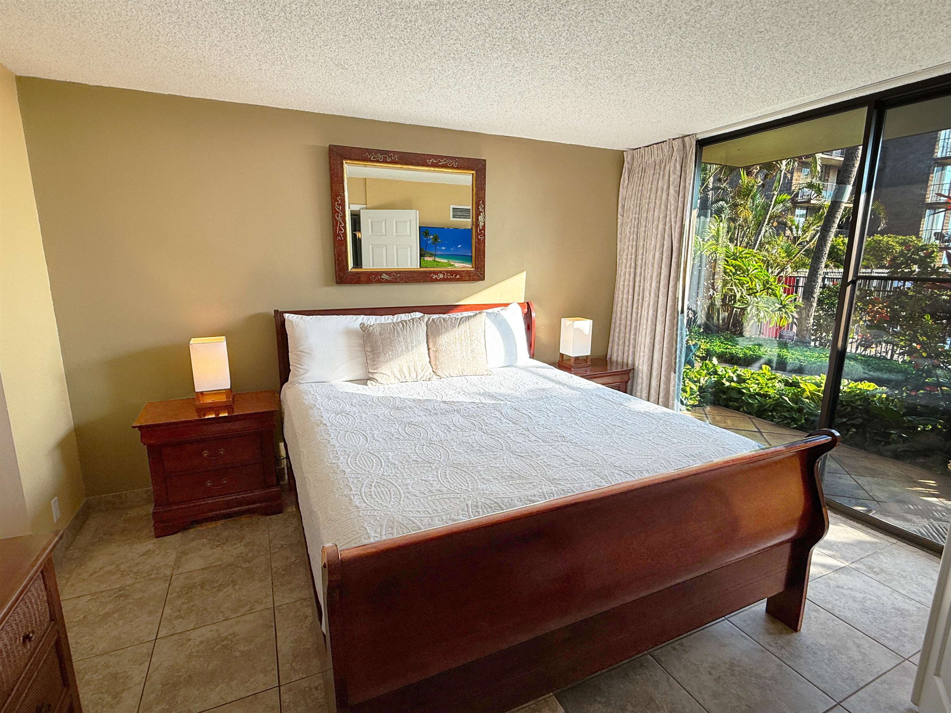 938 South Kihei Road, Unit 109 Kihei, HI 96753 - Photo 6 of 30 a bed sitting in a bedroom next to a window