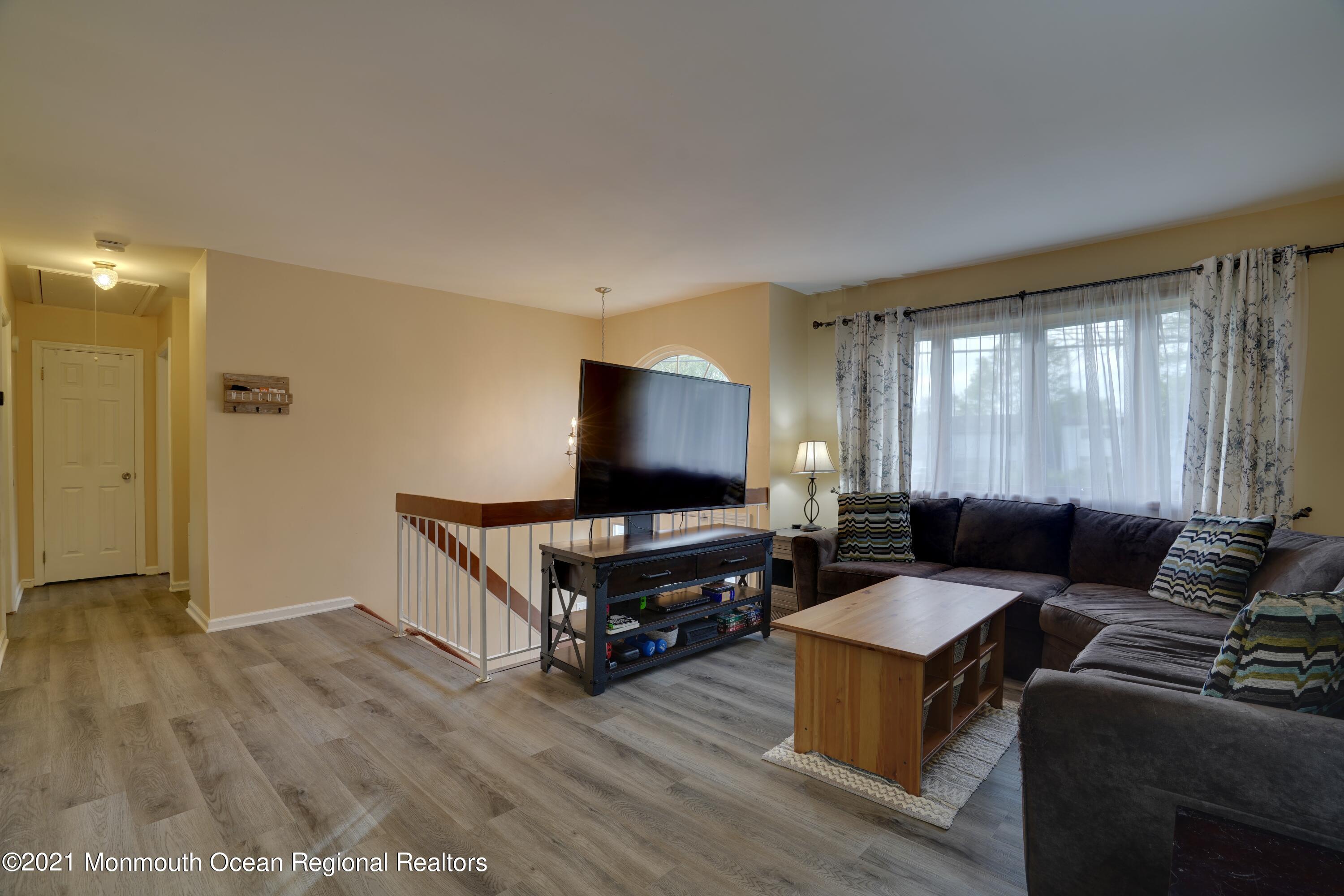 217 County Road Cliffwood, NJ 07721 - Photo 5 of 27 a living room with furniture and a flat screen tv