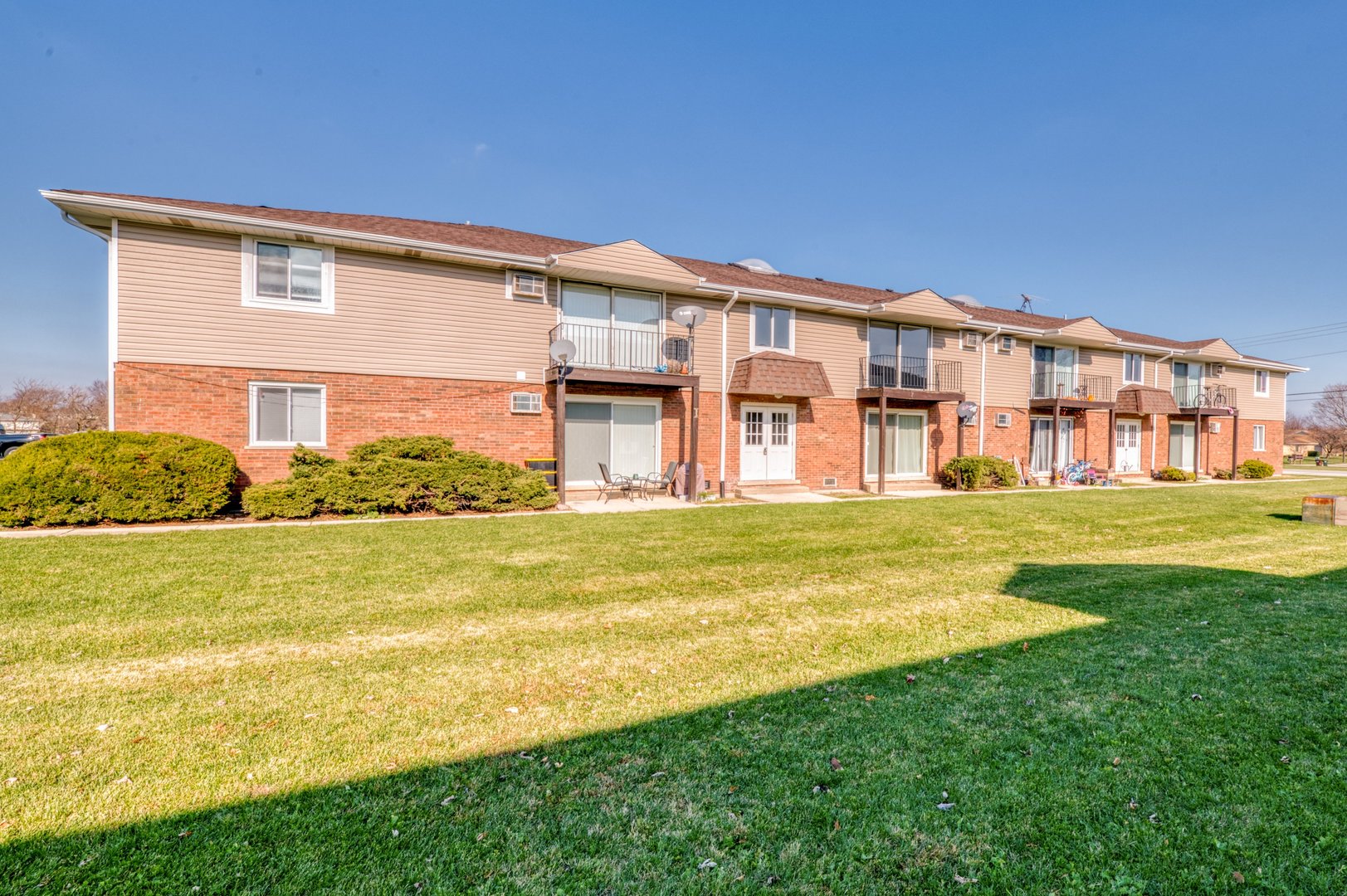 1713 Nelson Road, Unit 12 New Lenox, IL 60451 - Photo 1 of 14 a view of an apartment with a swimming pool