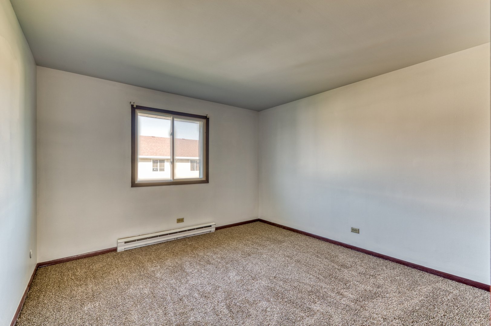 1713 Nelson Road, Unit 12 New Lenox, IL 60451 - Photo 12 of 14 an empty room with a window