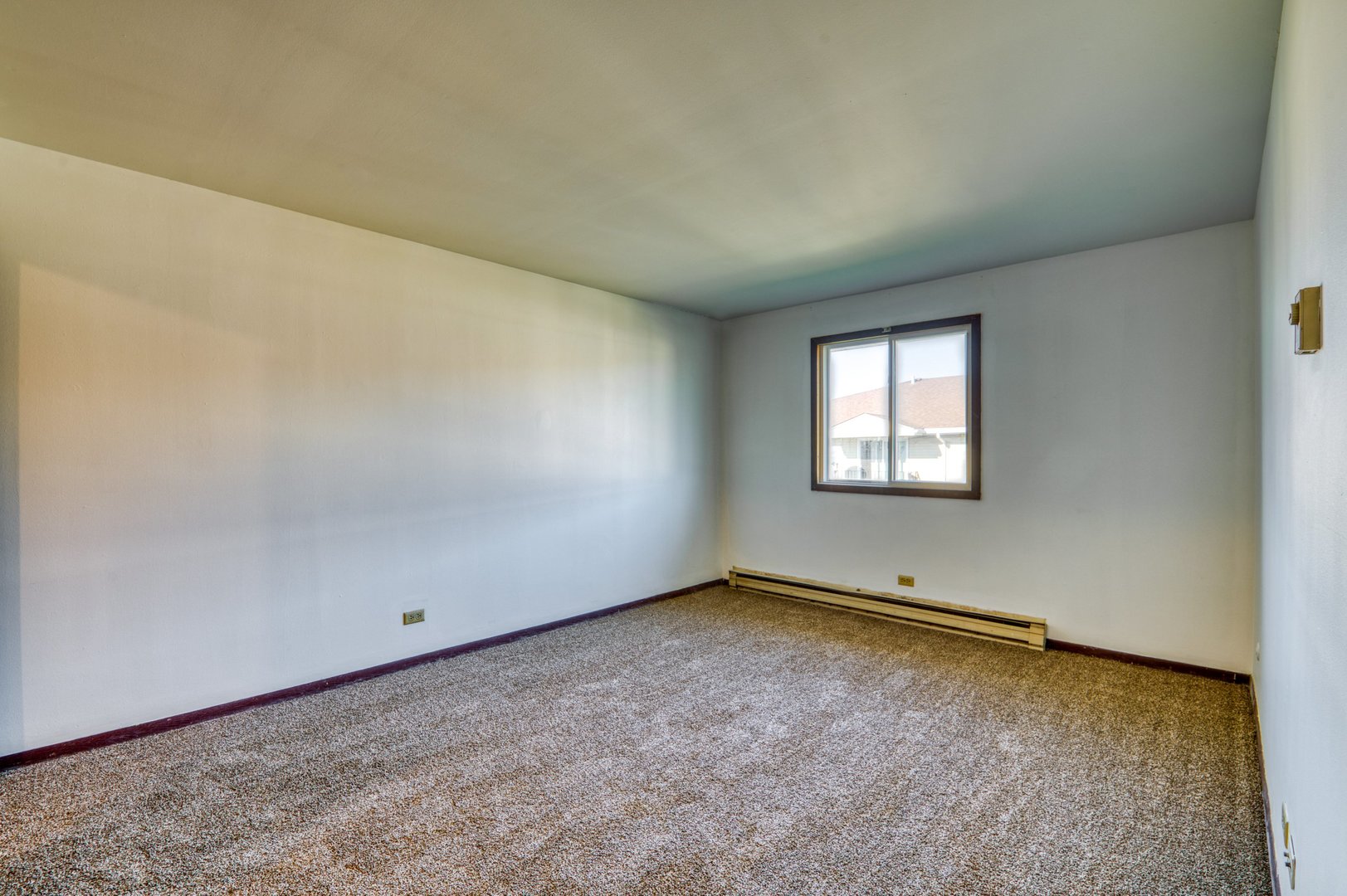 1713 Nelson Road, Unit 12 New Lenox, IL 60451 - Photo 13 of 14 a view of an empty room with a window