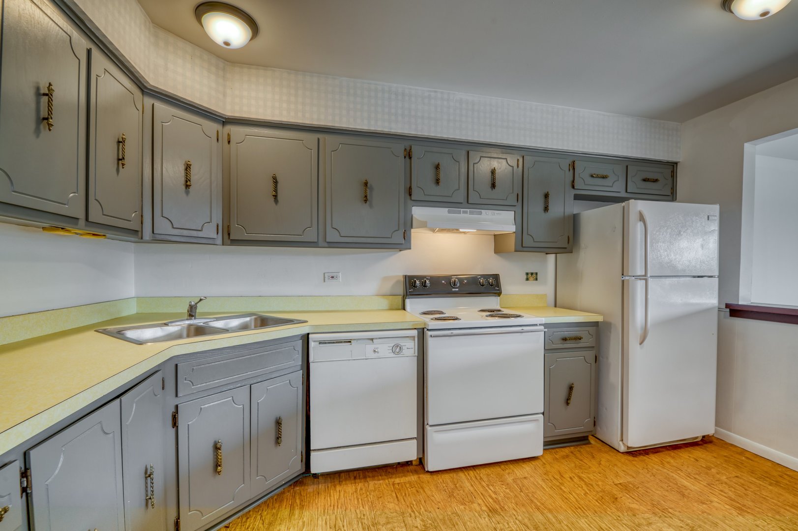 1713 Nelson Road, Unit 12 New Lenox, IL 60451 - Photo 9 of 14 a kitchen with a sink a refrigerator and cabinets