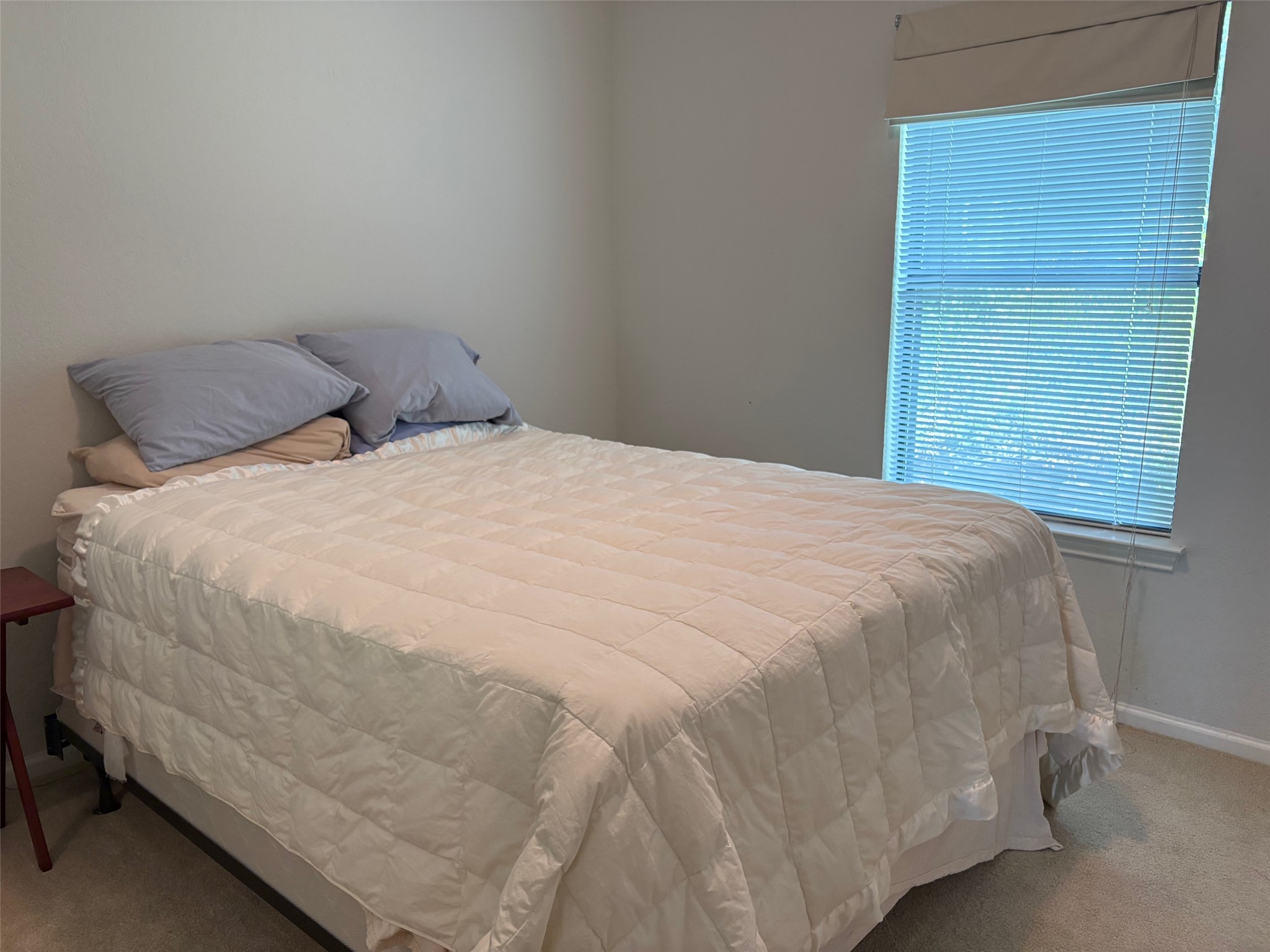 4711 Spicewood Springs Road, Unit 8146 Austin, TX 78759 - Photo 8 of 14 Bedroom with light carpet