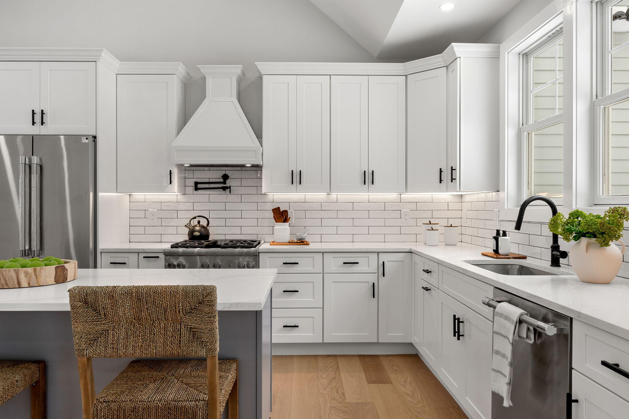 28 Spinnaker Street Sandwich, MA 02563 - Photo 15 of 55 a kitchen with stainless steel appliances granite countertop a stove a sink a microwave a refrigerator and white cabinets