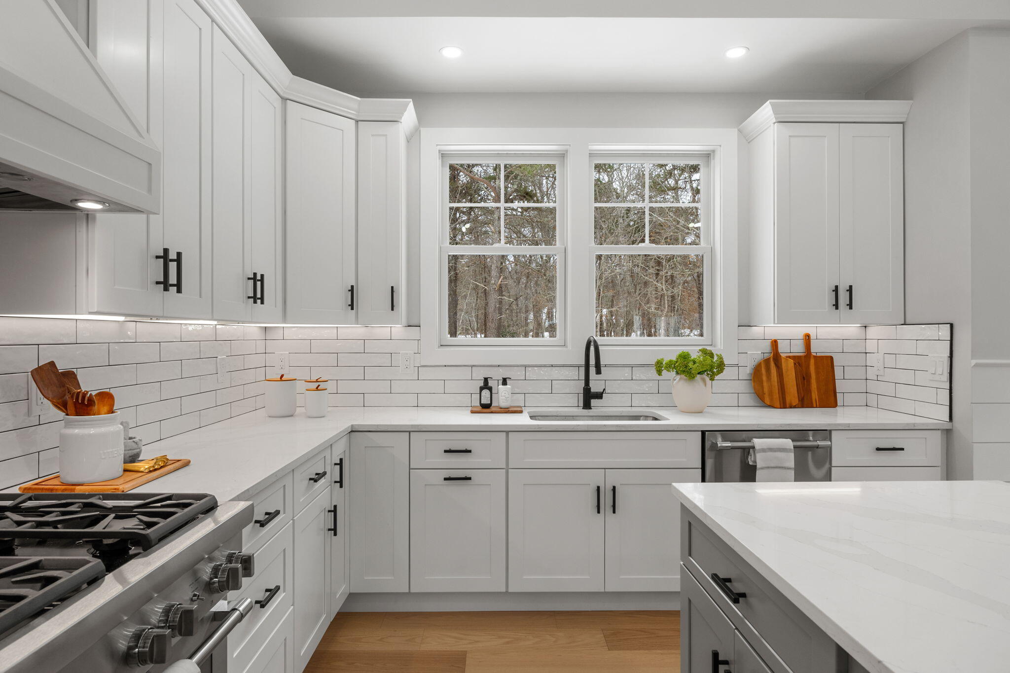 28 Spinnaker Street Sandwich, MA 02563 - Photo 16 of 55 a kitchen with a sink stove and cabinets