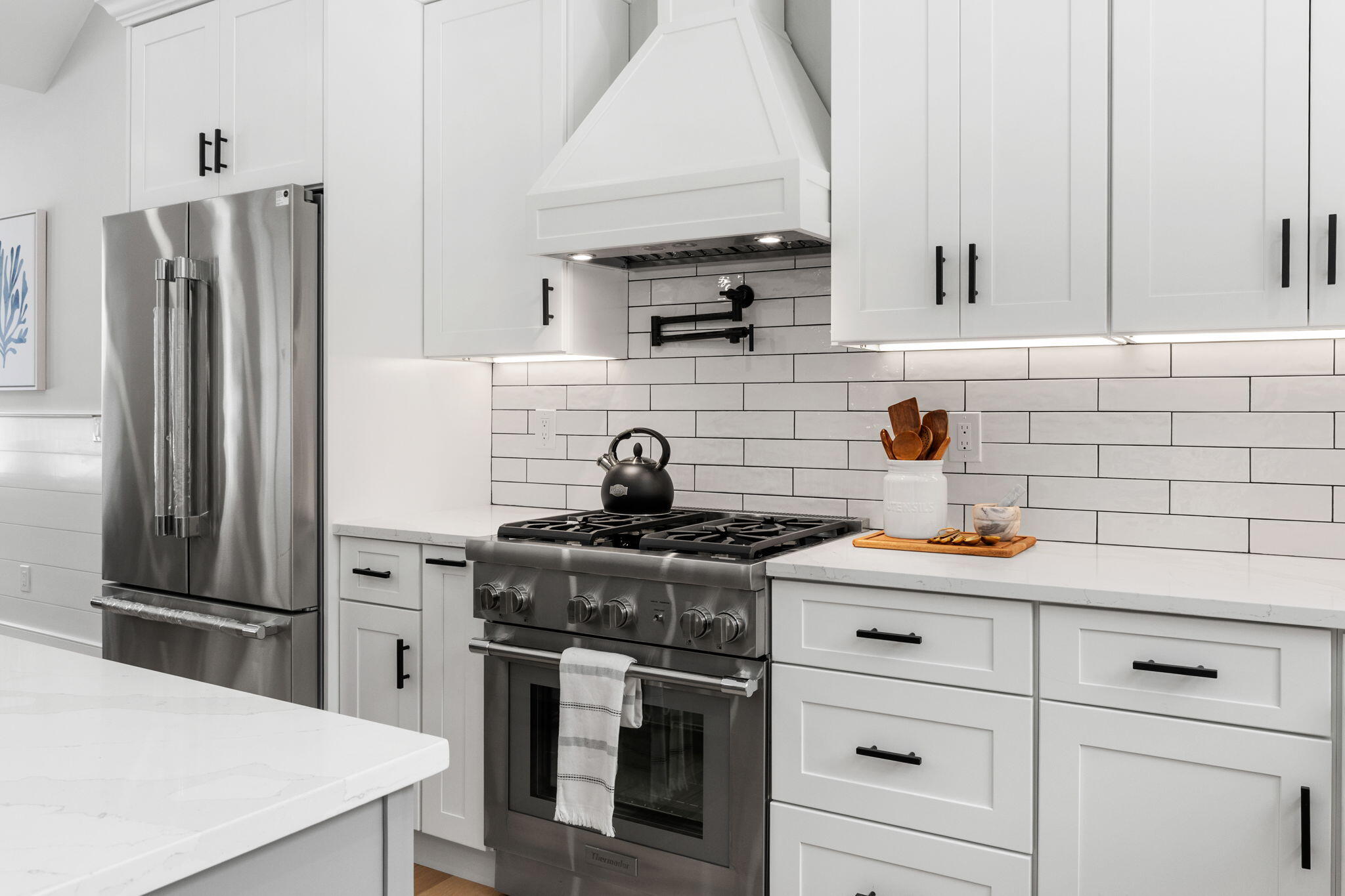 28 Spinnaker Street Sandwich, MA 02563 - Photo 18 of 55 a kitchen with stainless steel appliances a sink stove and refrigerator
