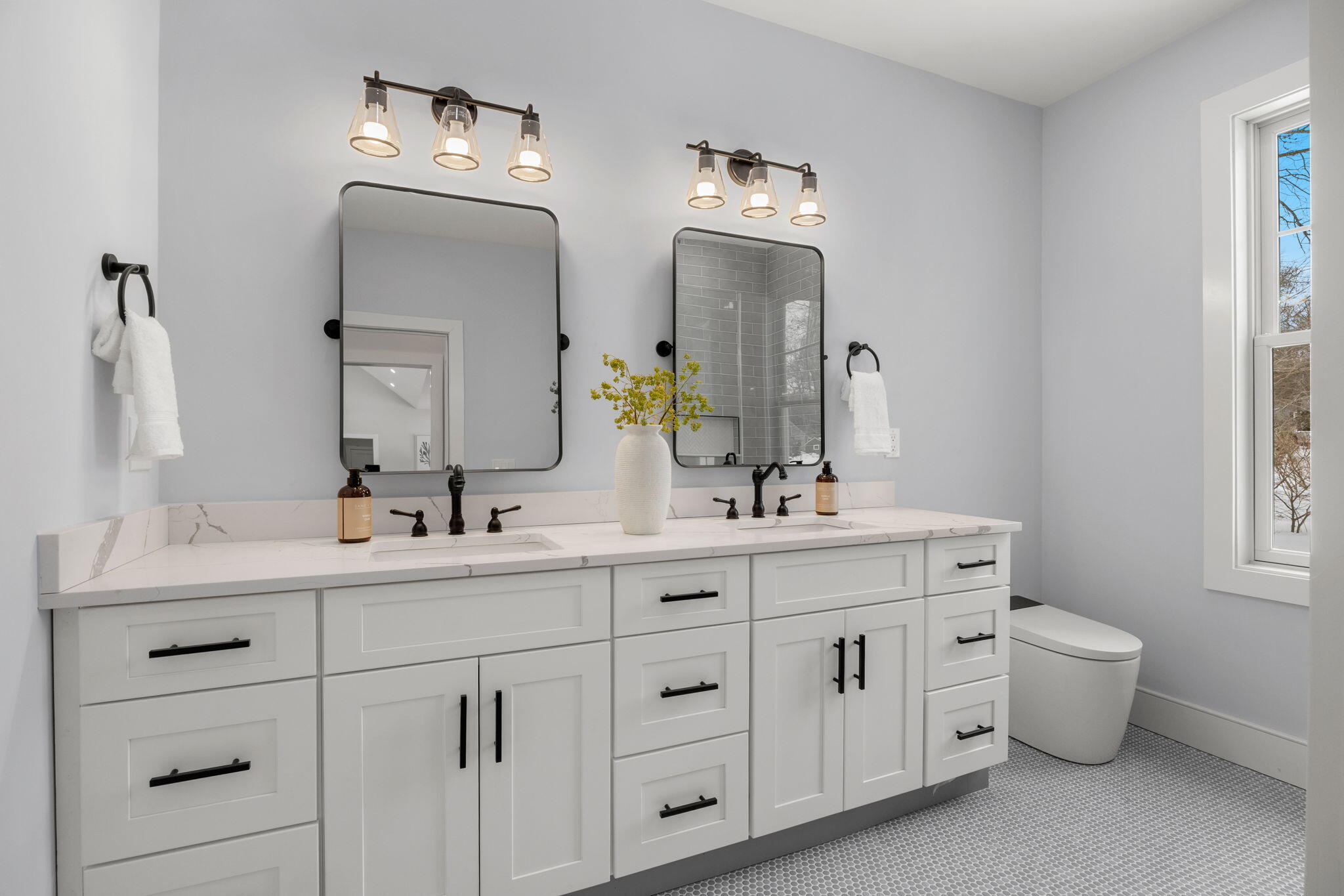 28 Spinnaker Street Sandwich, MA 02563 - Photo 39 of 55 a bathroom with double vanity sinks a toilet a mirror and window