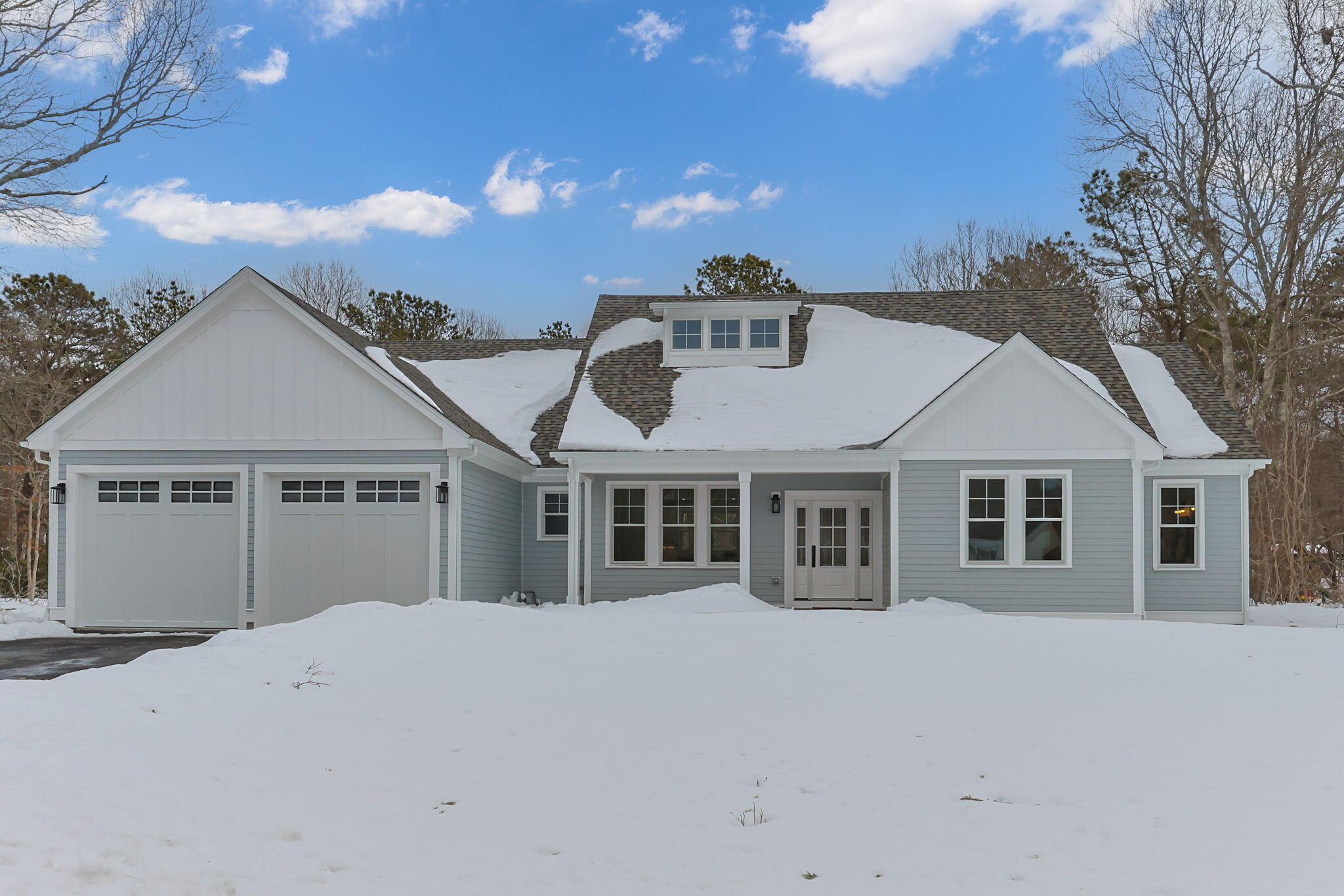28 Spinnaker Street Sandwich, MA 02563 - Photo 4 of 55 a front view of a house with a yard and garage