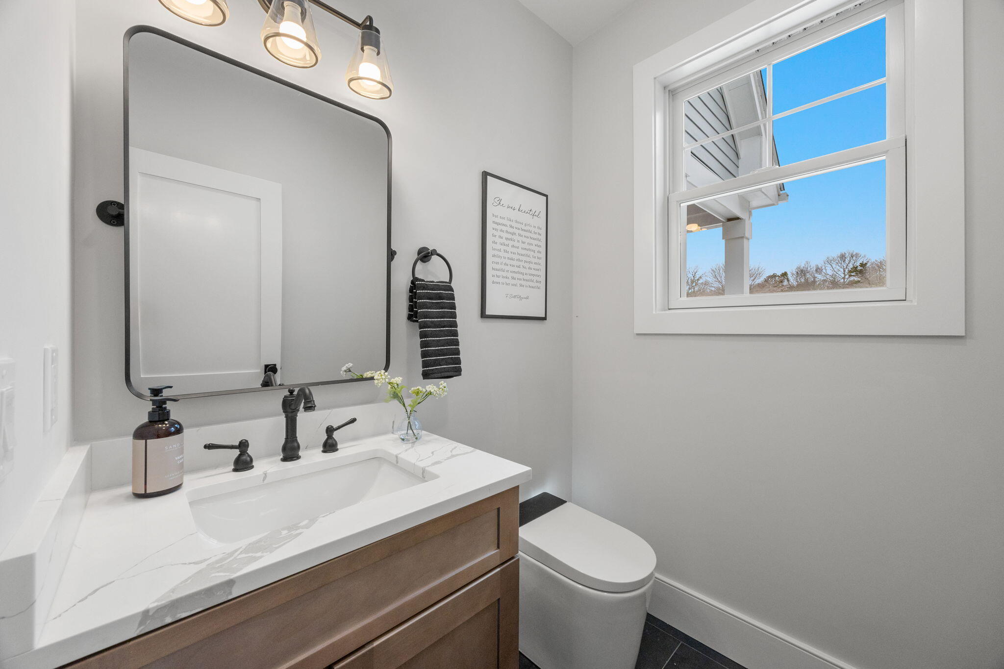 28 Spinnaker Street Sandwich, MA 02563 - Photo 42 of 55 a bathroom with a sink and a mirror