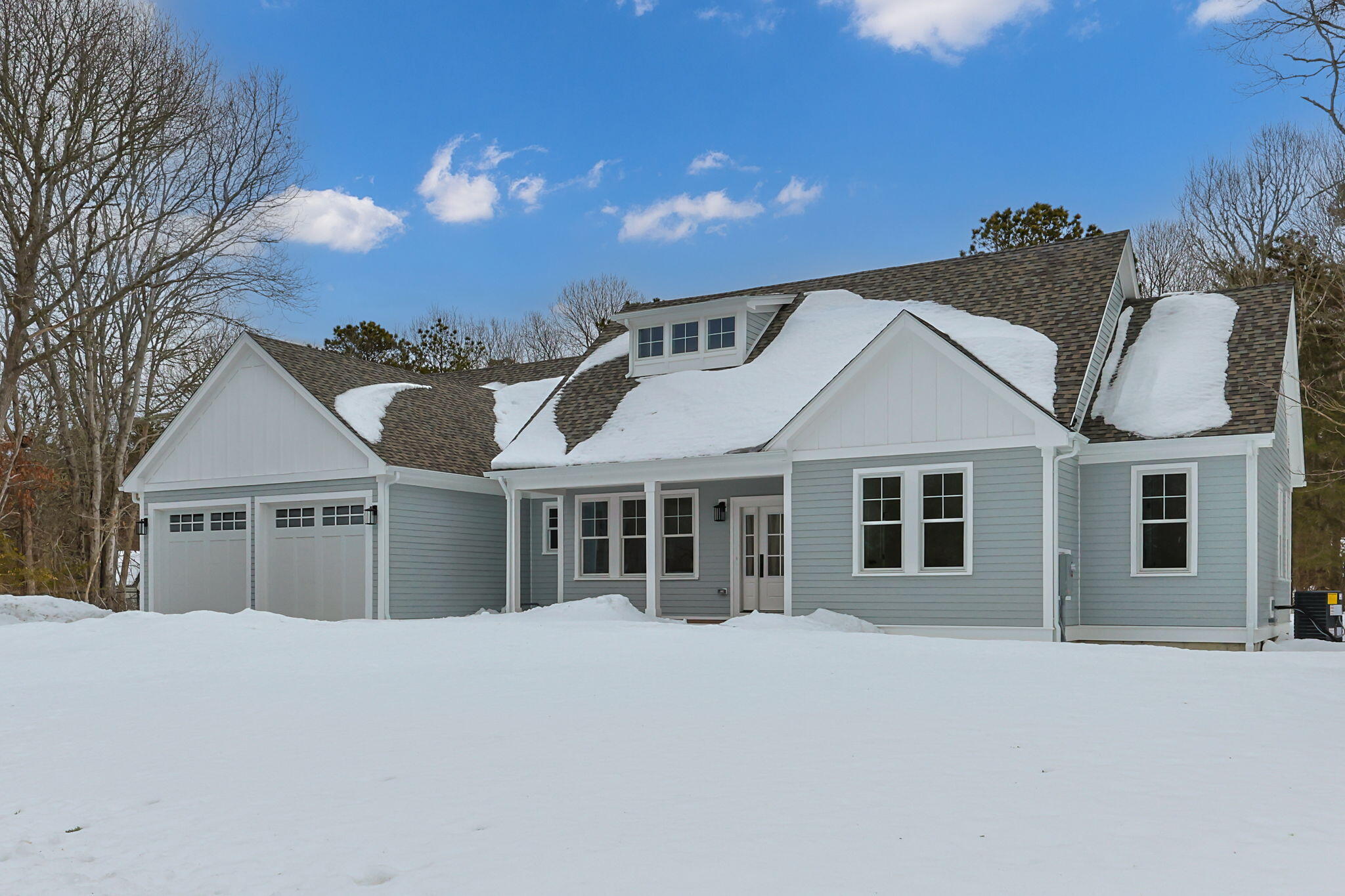 28 Spinnaker Street Sandwich, MA 02563 - Photo 5 of 55 a front view of a house with a yard and garage