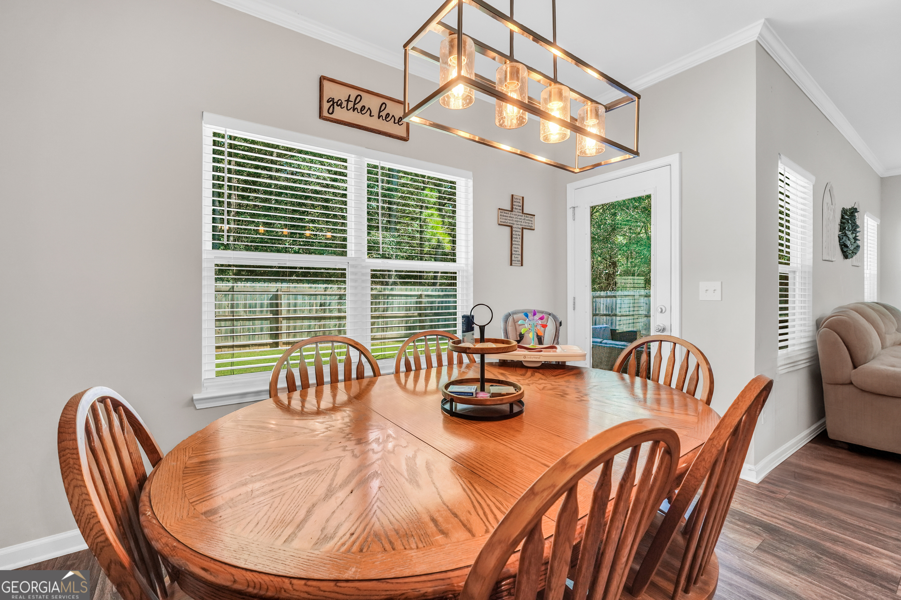 117 Charleston Lane Milner, GA 30257 - Photo 14 of 34 a dining room with furniture a livingroom and windows