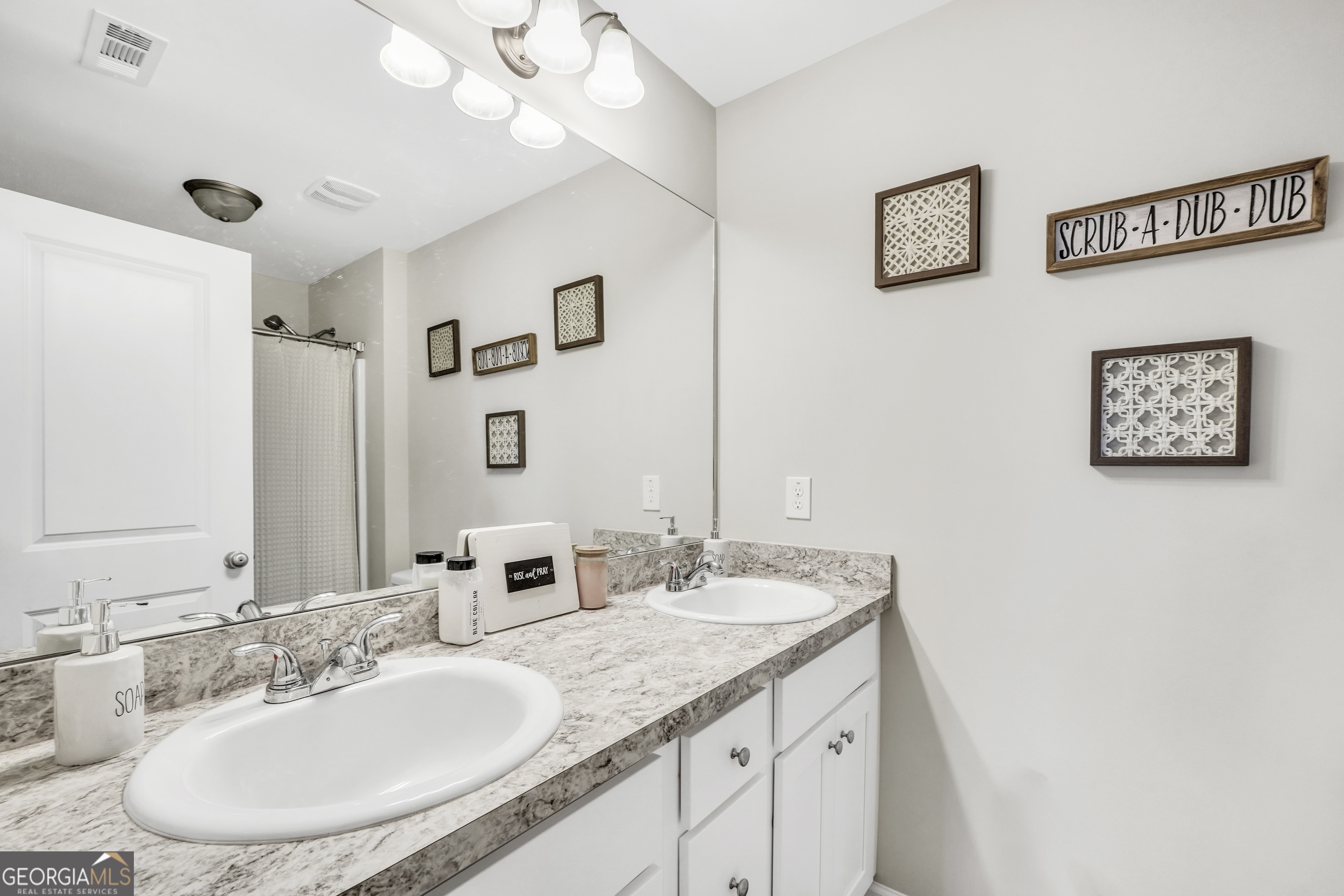 117 Charleston Lane Milner, GA 30257 - Photo 17 of 34 a bathroom with a granite countertop sink a mirror and a