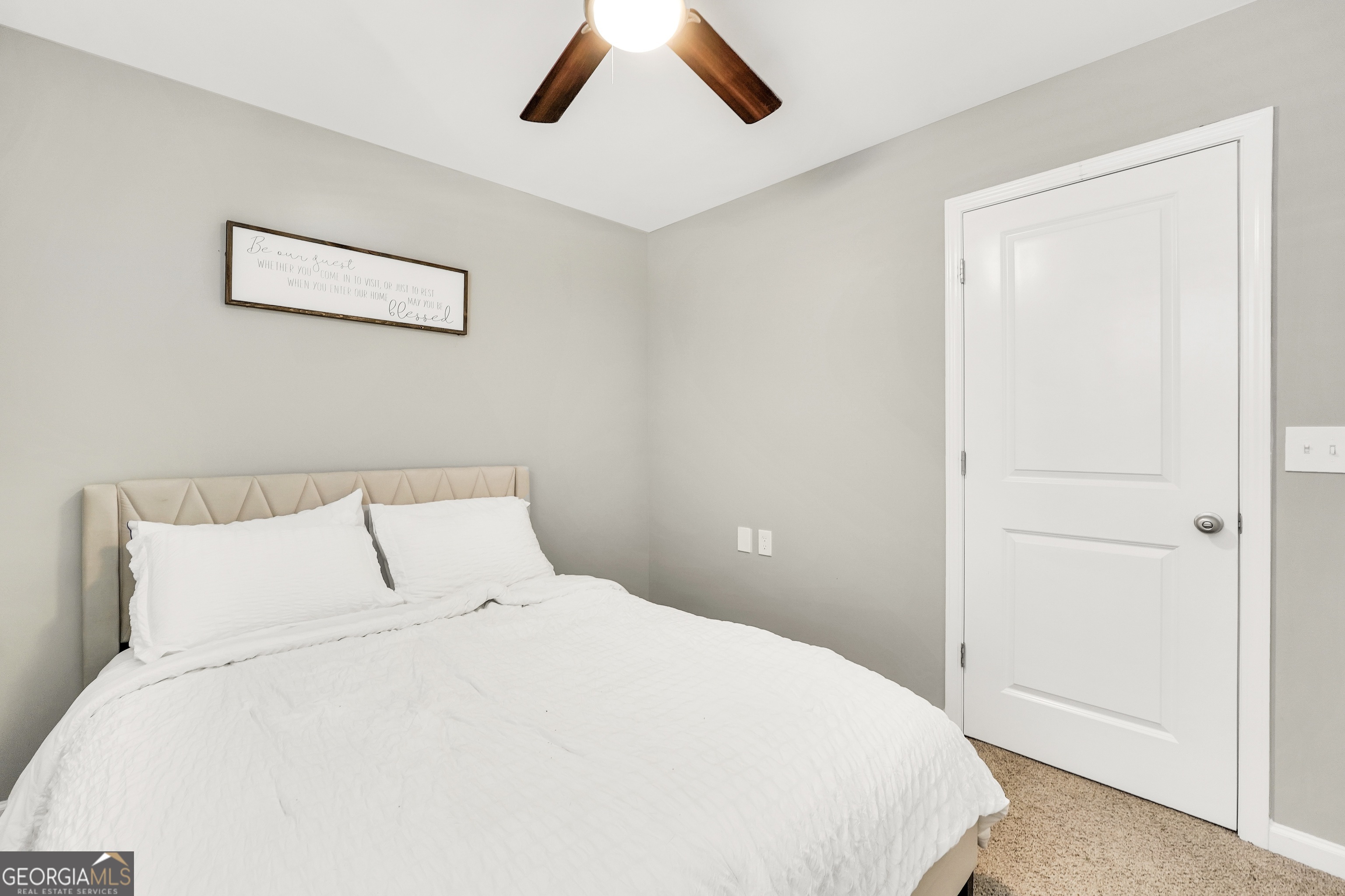 117 Charleston Lane Milner, GA 30257 - Photo 22 of 34 a large white bed in a white room