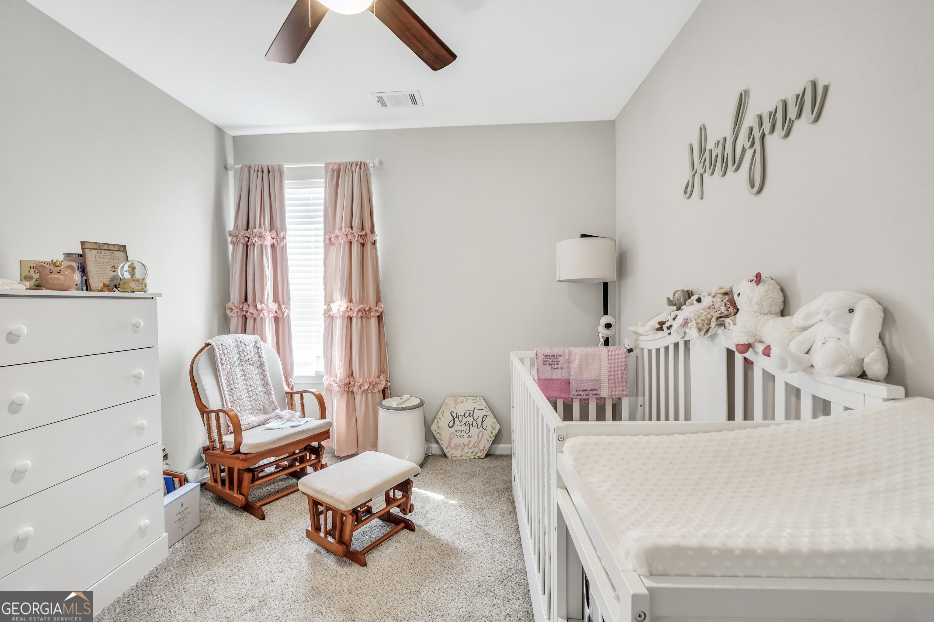 117 Charleston Lane Milner, GA 30257 - Photo 24 of 34 a bedroom with a bed and chair