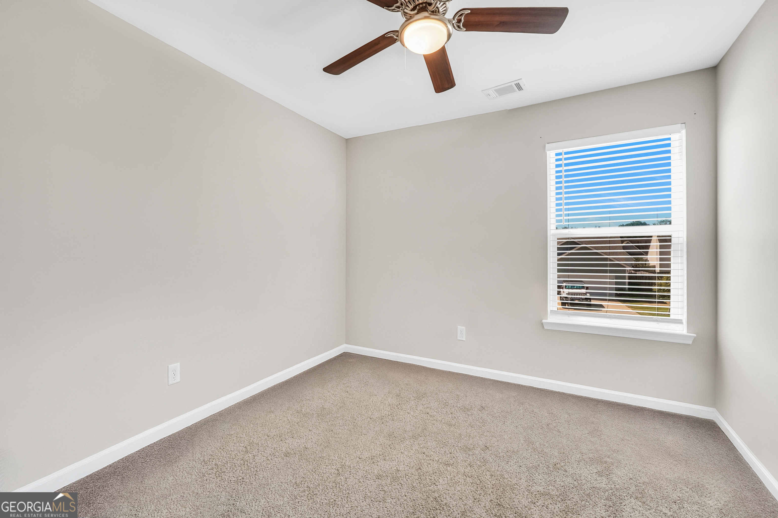 117 Charleston Lane Milner, GA 30257 - Photo 25 of 34 a view of an empty room with a window