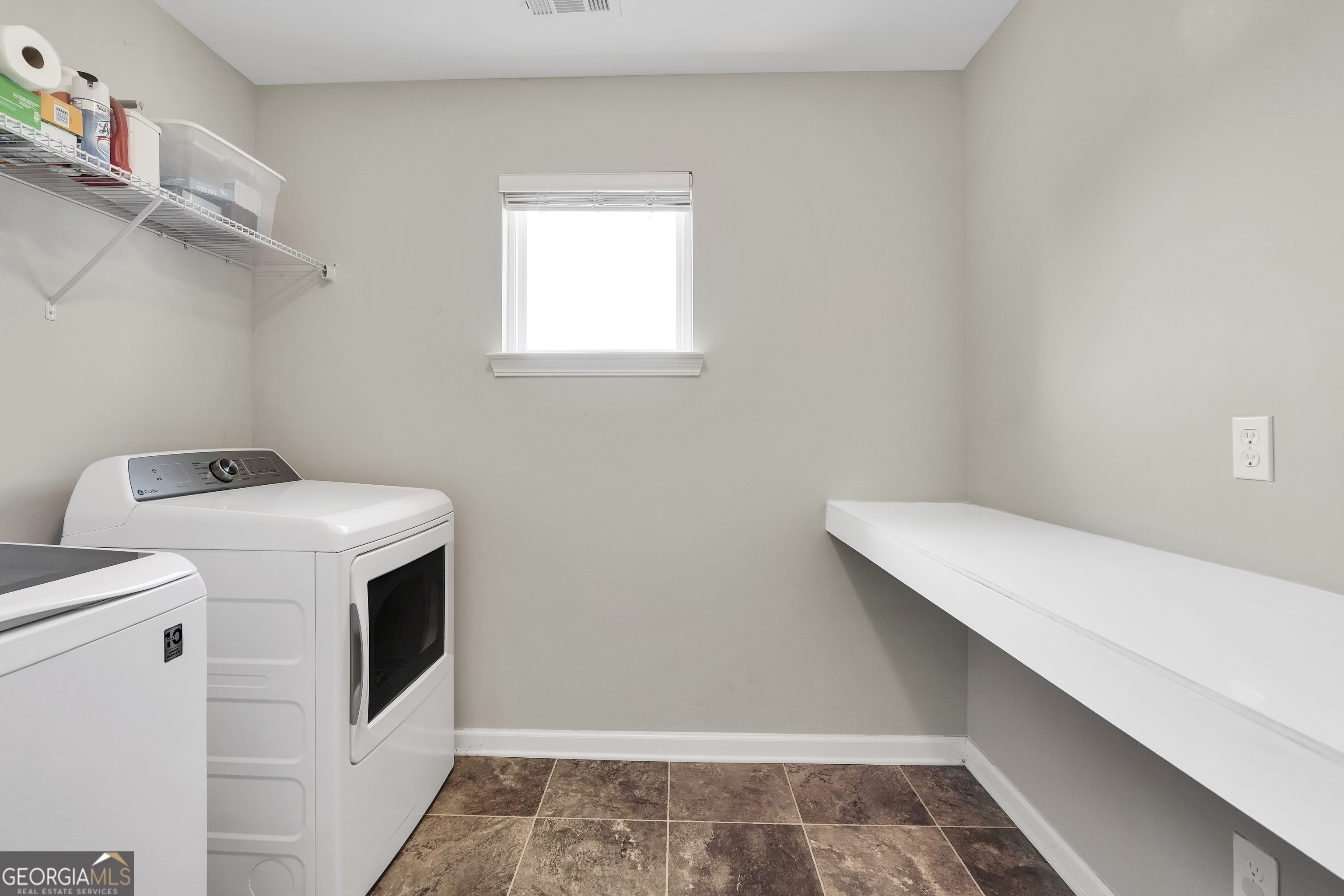 117 Charleston Lane Milner, GA 30257 - Photo 28 of 34 a utility room with dryer and washer