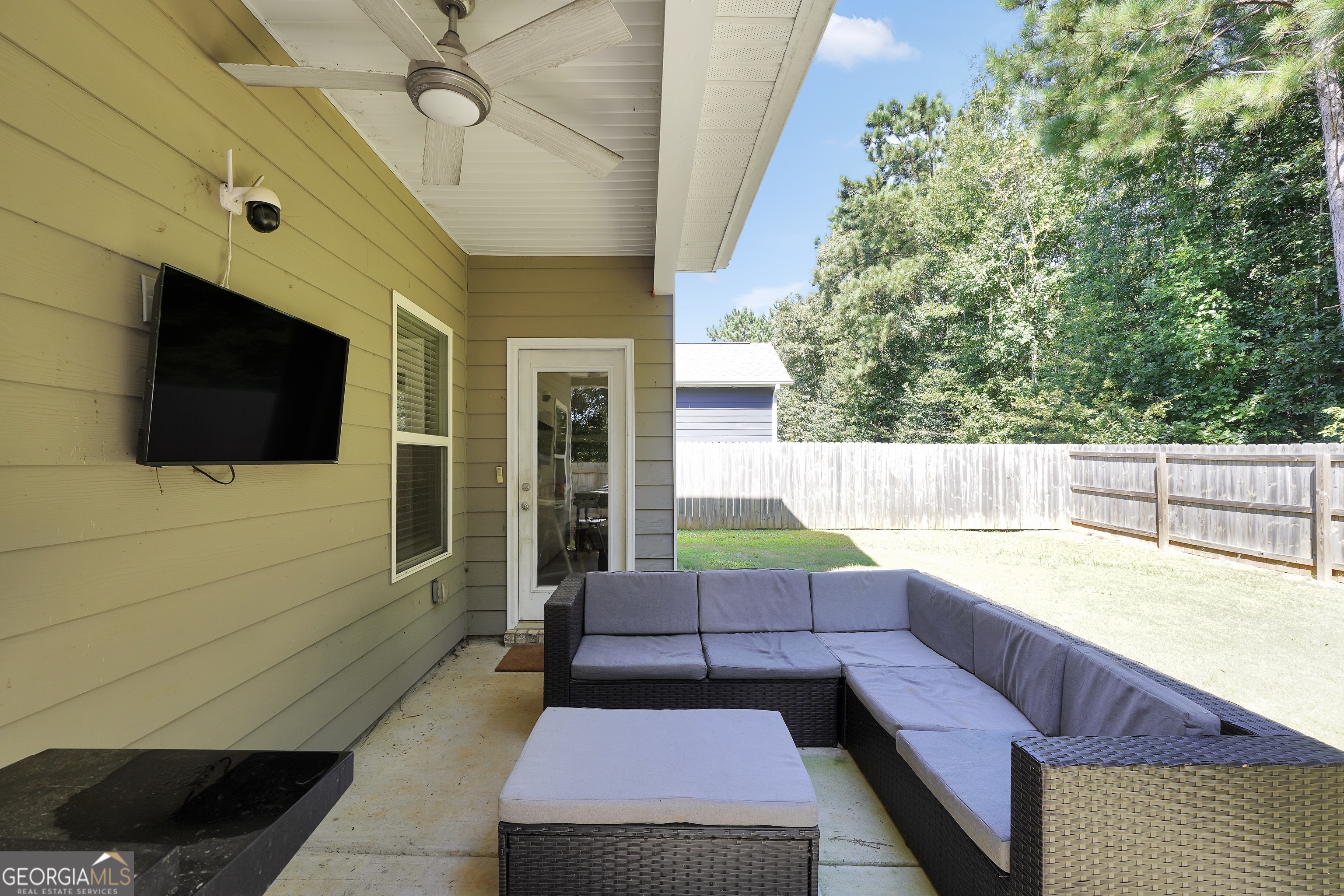117 Charleston Lane Milner, GA 30257 - Photo 30 of 34 a view of a porch with furniture