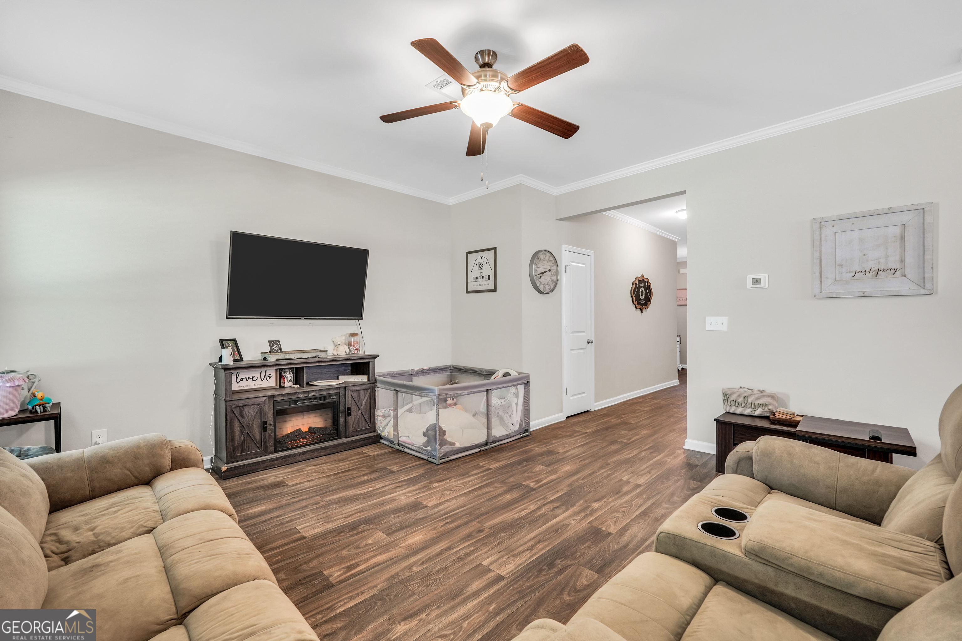 117 Charleston Lane Milner, GA 30257 - Photo 5 of 34 a living room with furniture and a flat screen tv