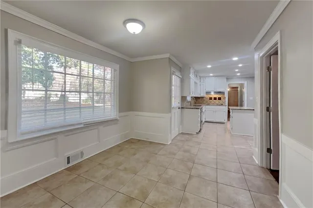a view of a kitchen with a sink and cabinets