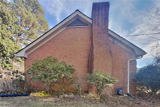 a house with trees in front of it