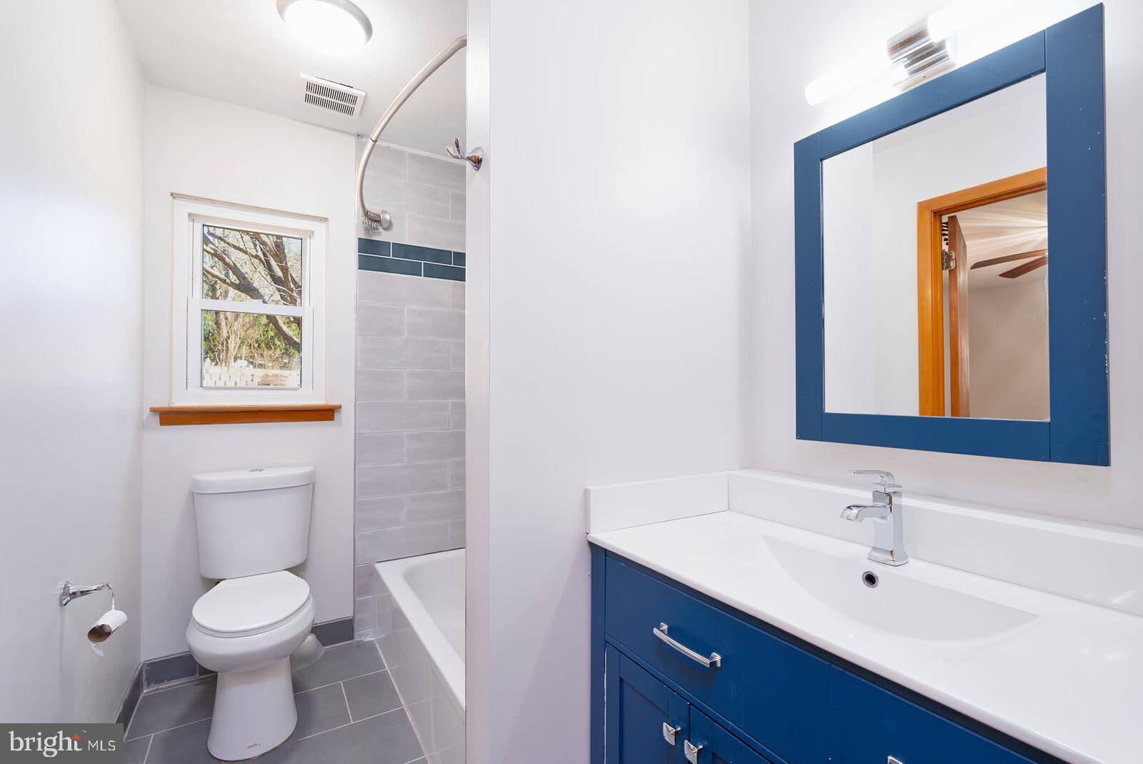 4921 Buffalo Road Mount Airy, MD 21771 - Photo 11 of 36 a bathroom with a toilet sink and mirror