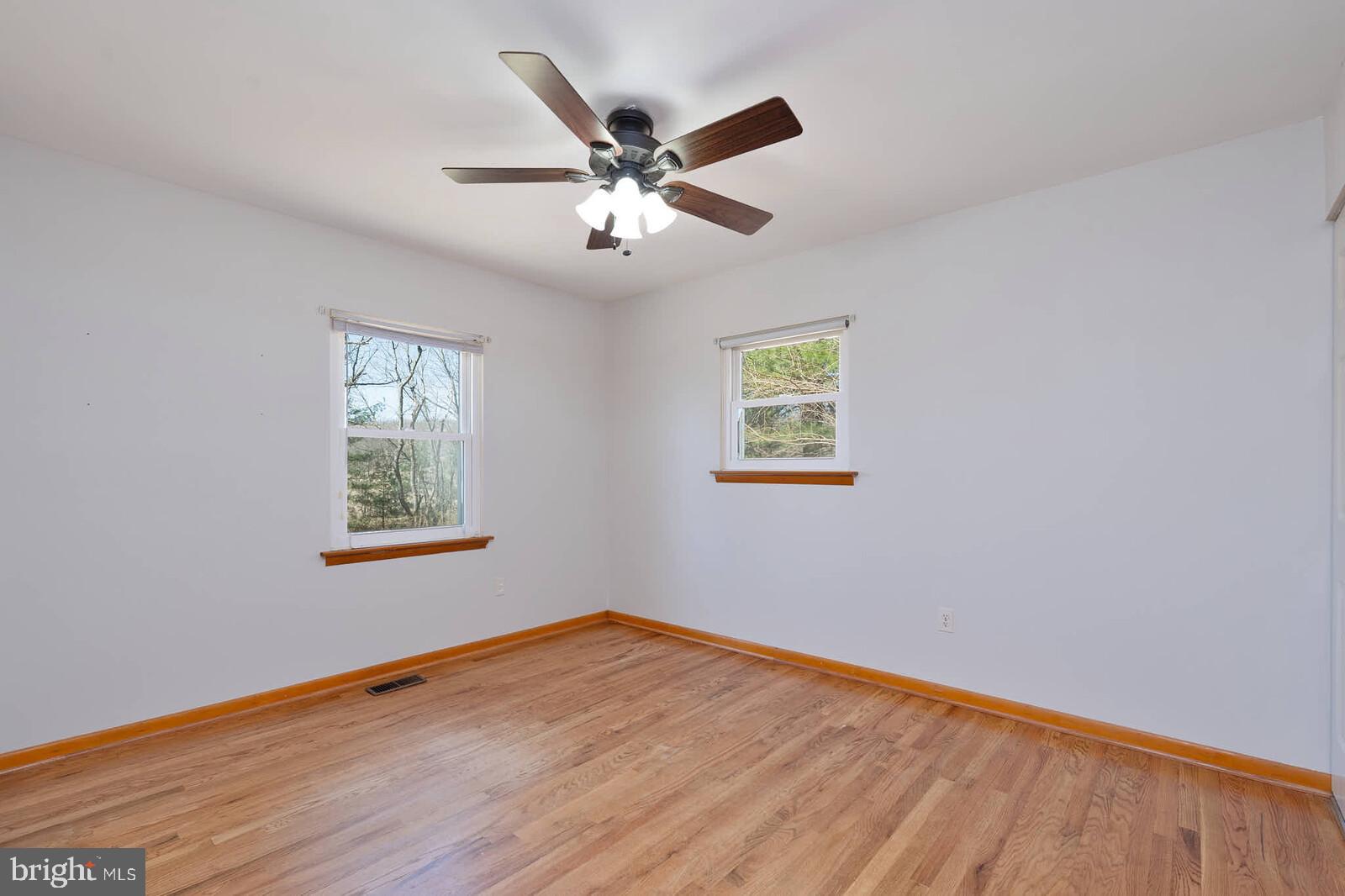 4921 Buffalo Road Mount Airy, MD 21771 - Photo 14 of 36 a view of a big room with wooden floor and windows