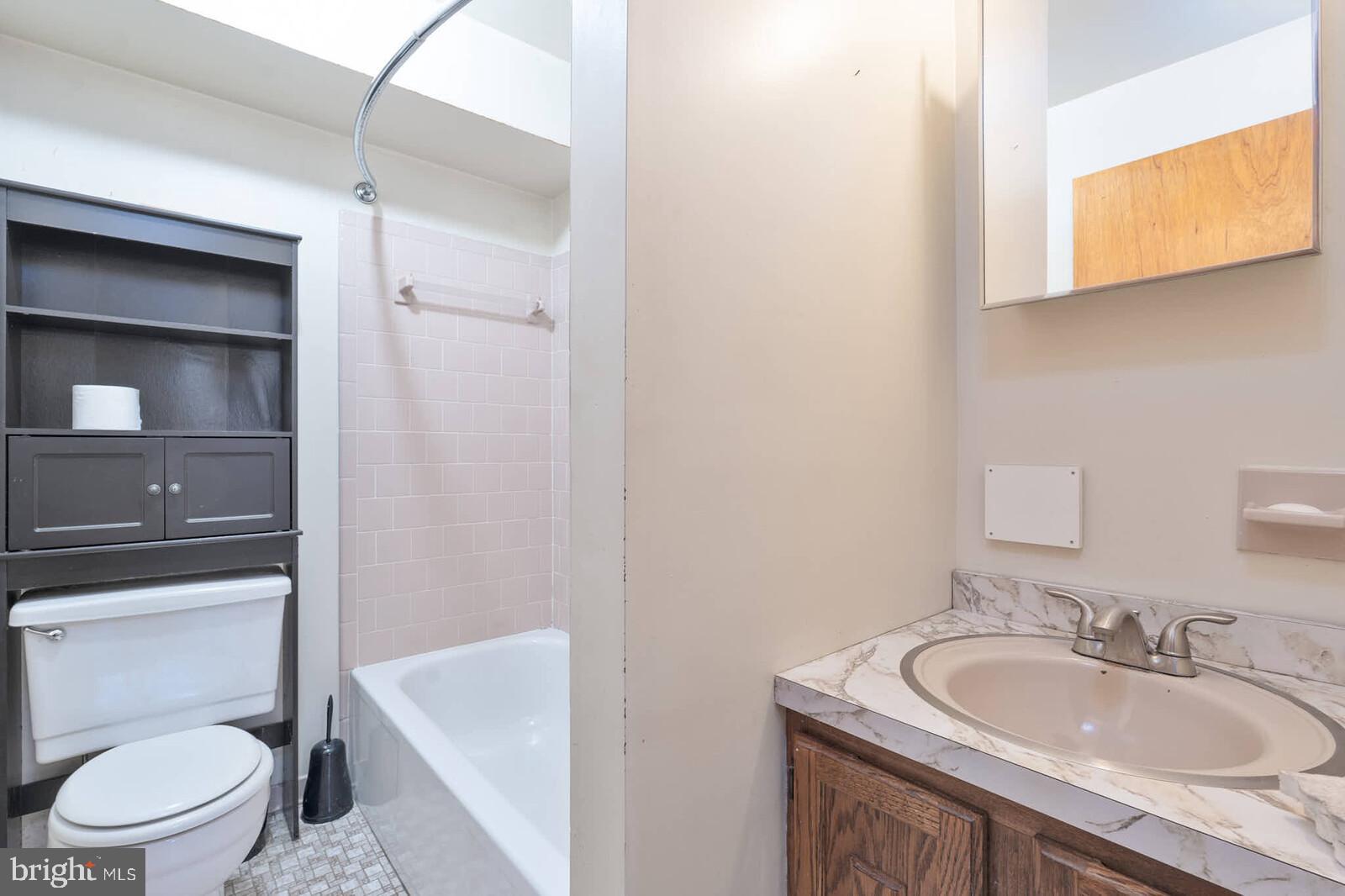 4921 Buffalo Road Mount Airy, MD 21771 - Photo 22 of 36 a bathroom with a sink toilet and vanity