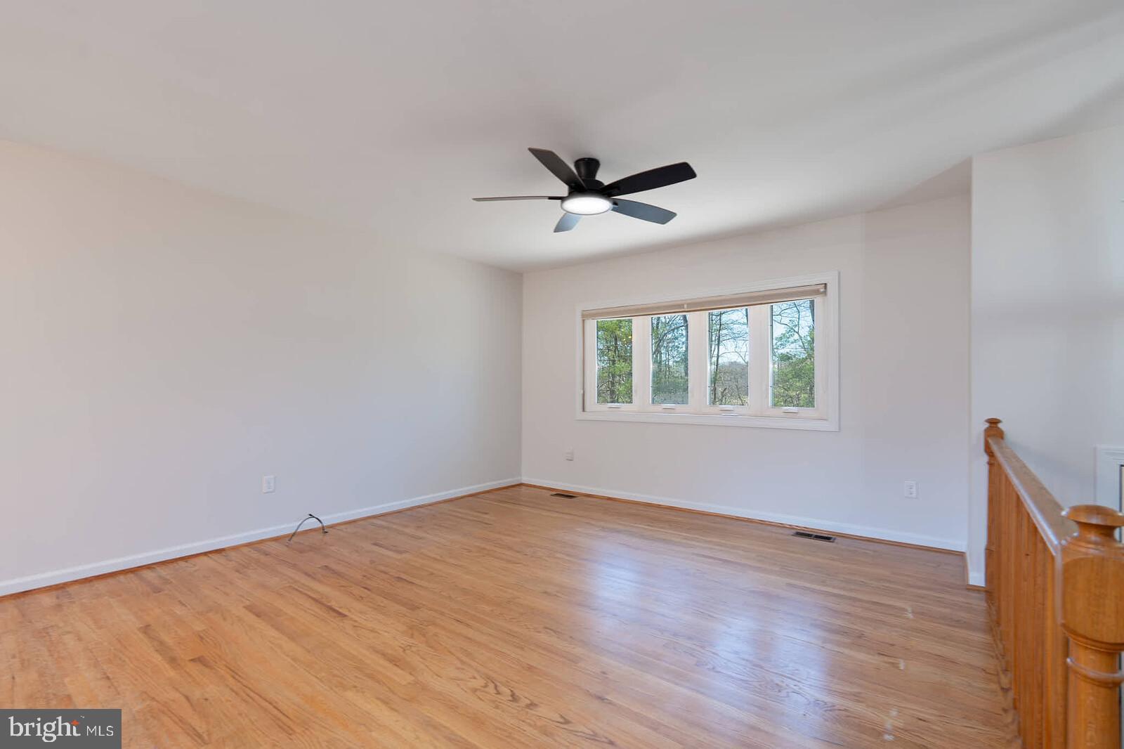 4921 Buffalo Road Mount Airy, MD 21771 - Photo 5 of 36 a view of empty room with wooden floor and fan