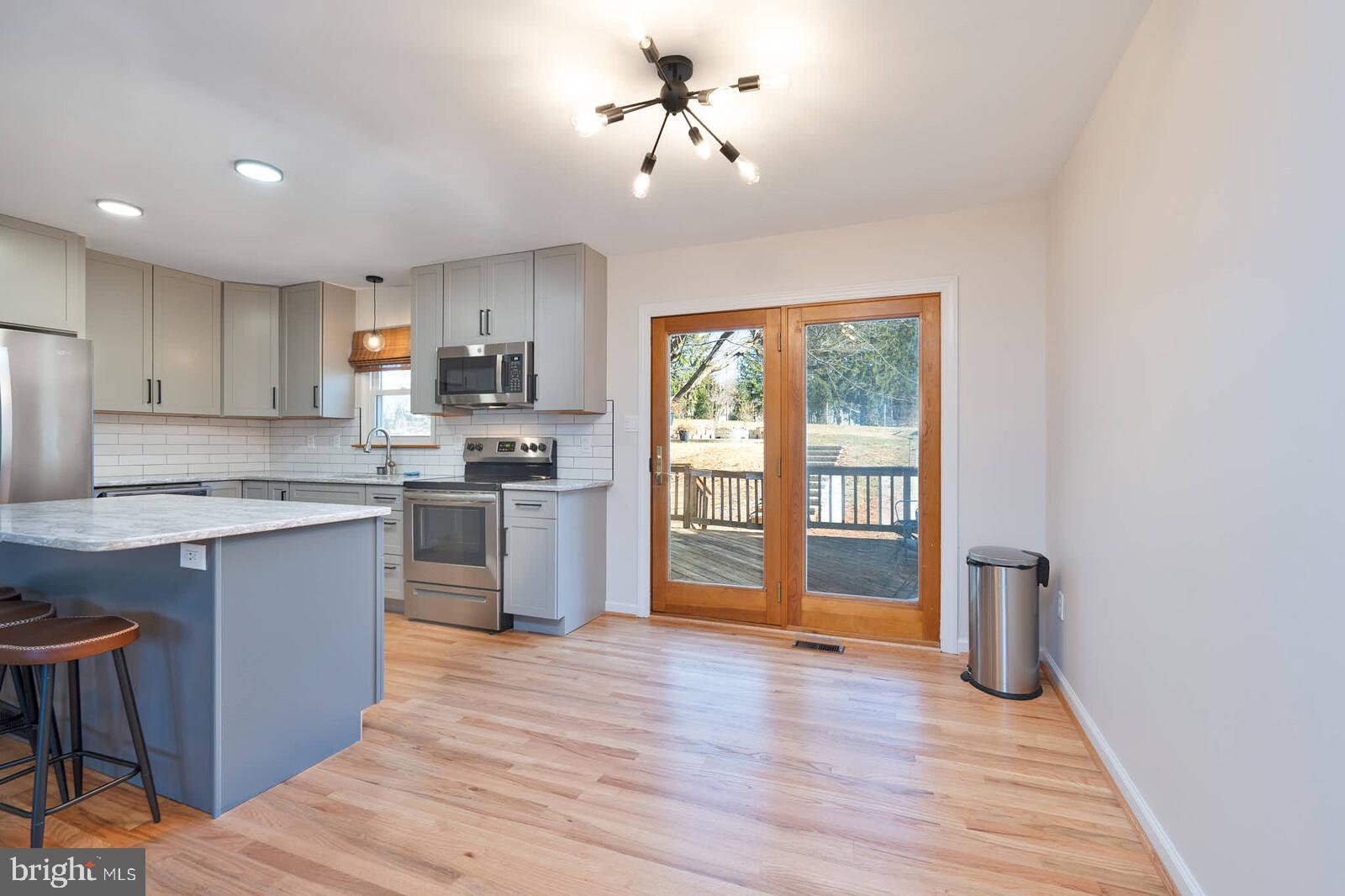 4921 Buffalo Road Mount Airy, MD 21771 - Photo 7 of 36 a kitchen with a refrigerator and a sink