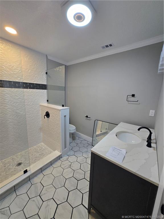420 Southwest 7th Street Stuart, FL 34994 - Photo 16 of 17 a bathroom with a sink toilet and shower