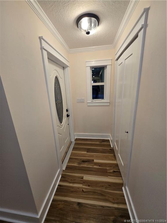 420 Southwest 7th Street Stuart, FL 34994 - Photo 3 of 17 a view of a hallway with wooden floor and entryway