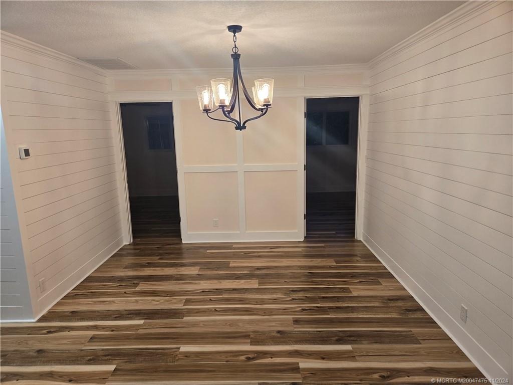 420 Southwest 7th Street Stuart, FL 34994 - Photo 6 of 17 a view of empty room with wooden floor