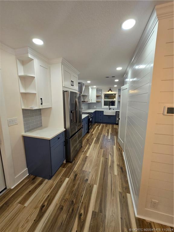 420 Southwest 7th Street Stuart, FL 34994 - Photo 7 of 17 a view of kitchen with refrigerator microwave and stove