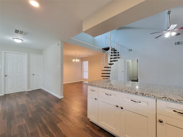 a view of cabinets and wooden floor