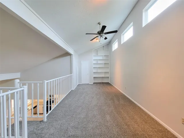 a view of a hallway with staircase
