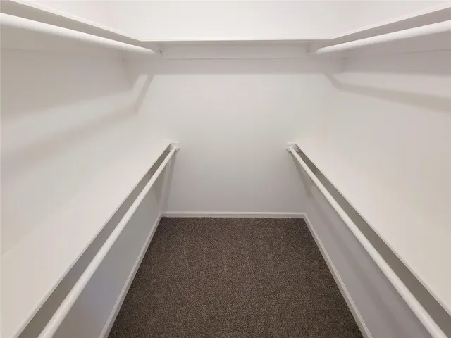 a view of hallway with empty room