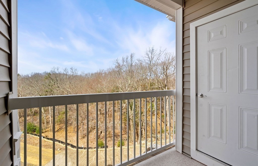 2 Stratton Drive, Unit 305 Woburn, MA 01801 - Photo 12 of 15 a view of a balcony with trees